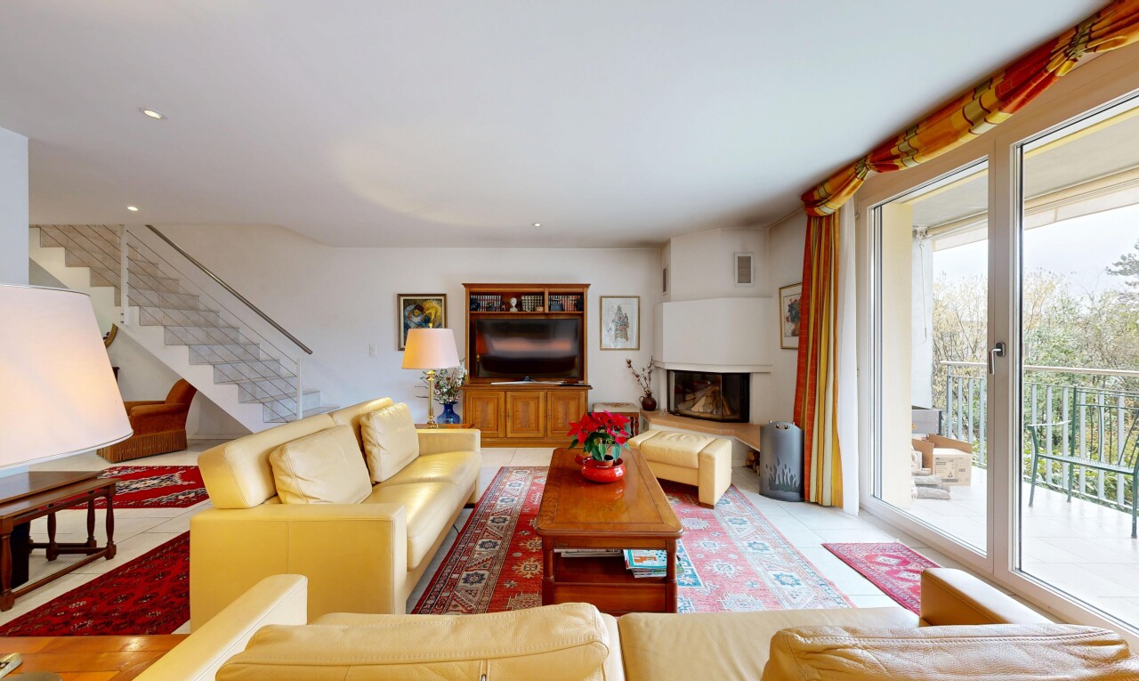 living area featuring stairway