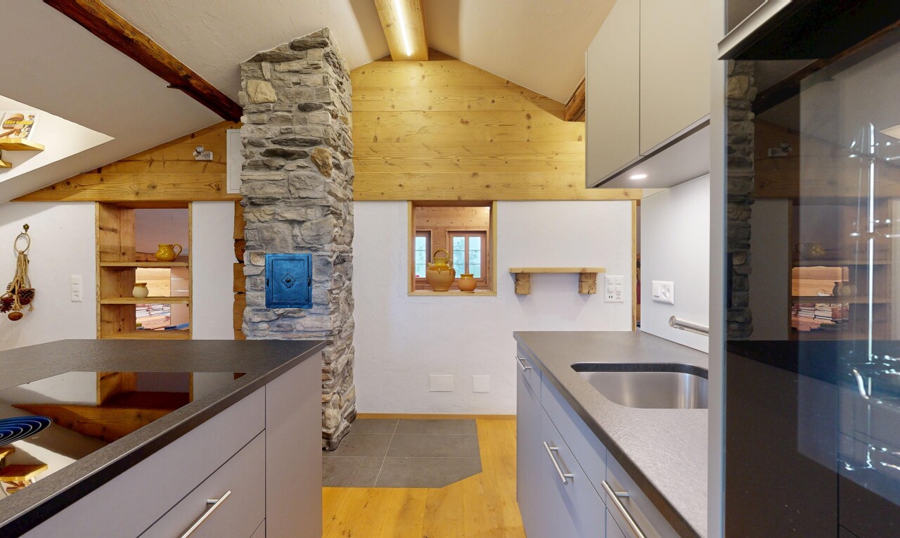 küche mit light floor, dark countertops, holzfußboden, wood finish floor, und inside property