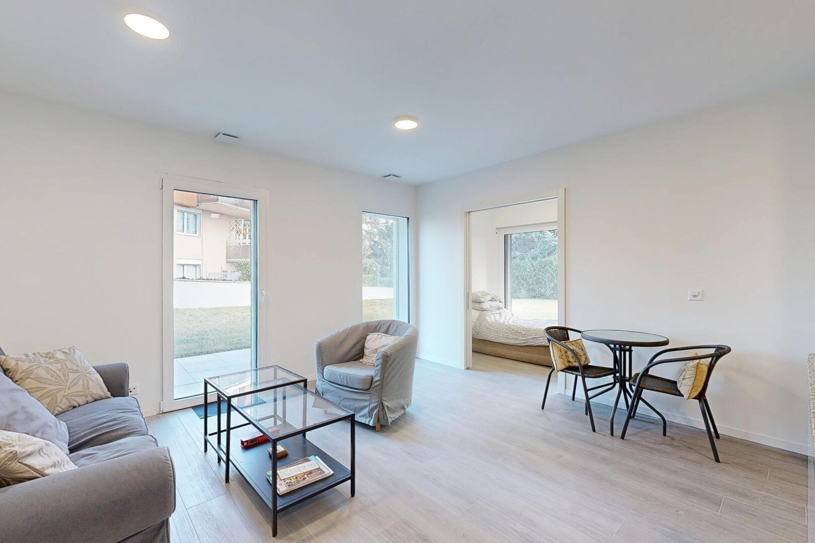 living area with light wood finished floors and recessed lighting