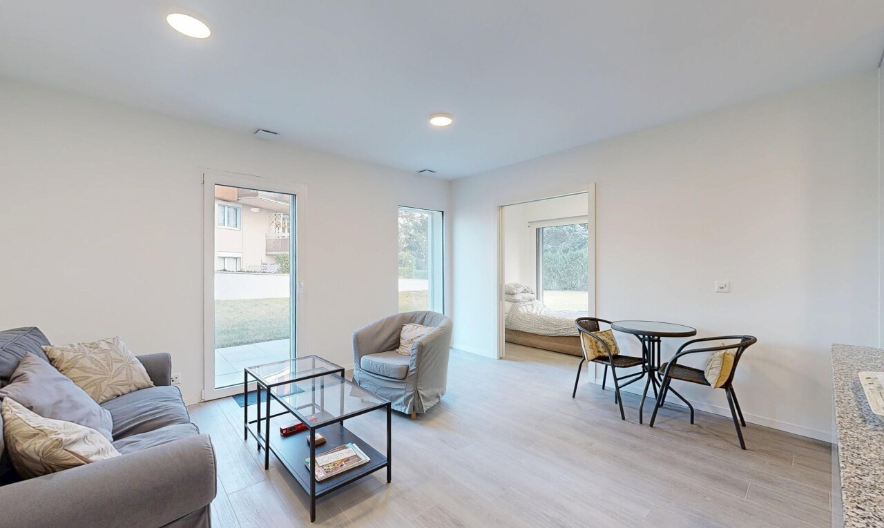 living area with light wood finished floors and recessed lighting
