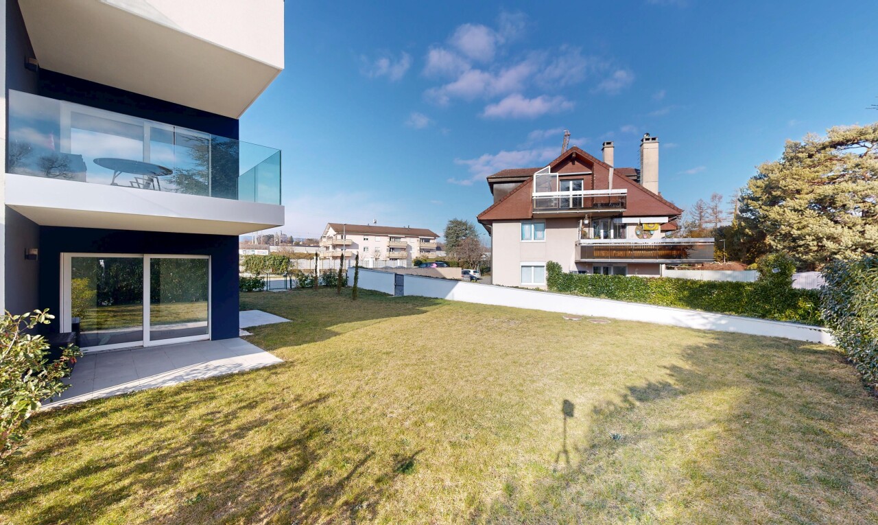outdoor house featuring a yard and a chimney