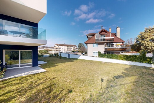 outdoor house featuring a yard and a chimney