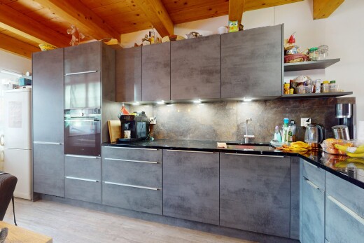 küche mit balkendecke, beamed ceiling, schränke mit flachen paneelen, kühlschrank, und ofen