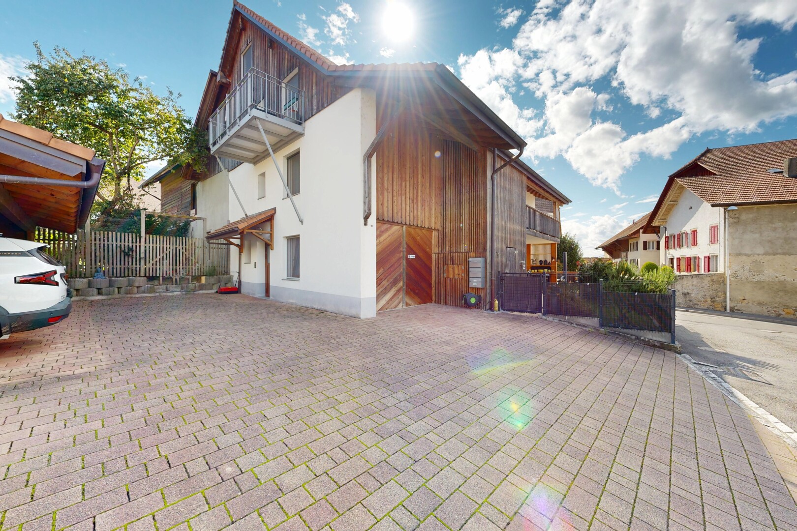 view of home featuring a balcony