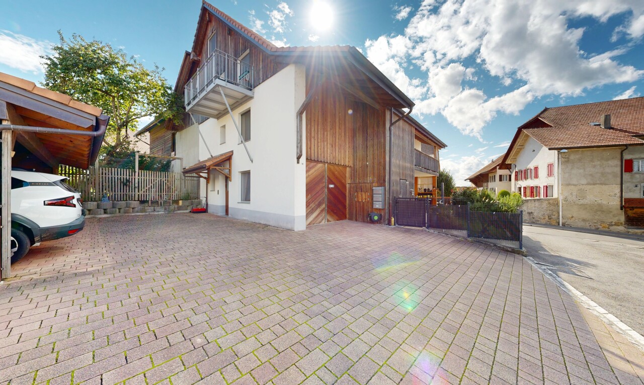 view of home featuring a balcony