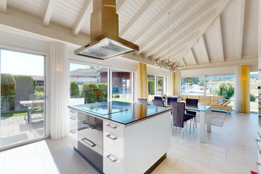 küche mit balkendecke, beamed ceiling, schränke mit flachen paneelen, dunstabzugshaube, und natürliches licht