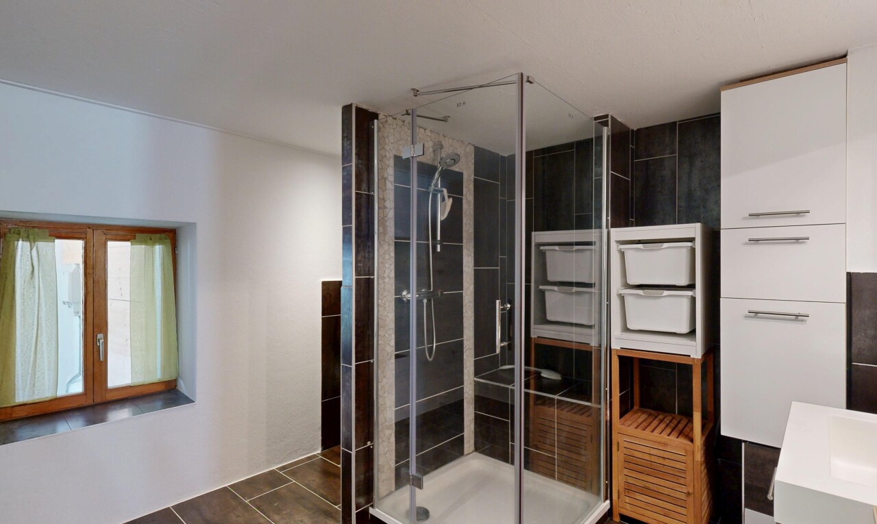bathroom featuring a shower stall