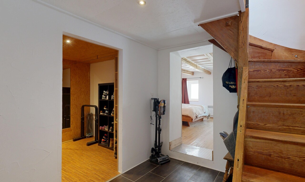 stairs featuring recessed lighting and wood finished floors