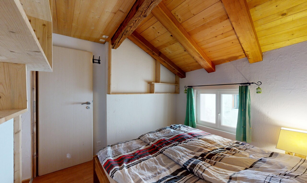 room / bedroom featuring lofted ceiling with beams, wooden ceiling, and wood finished floors