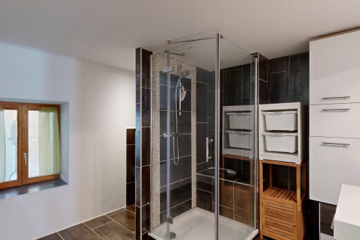 bathroom featuring a shower stall