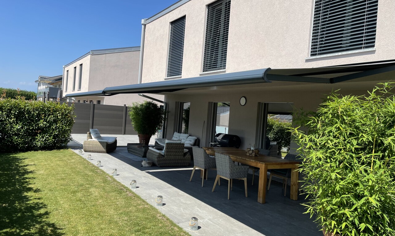 terrace featuring a patio area and an outdoor living / dining area