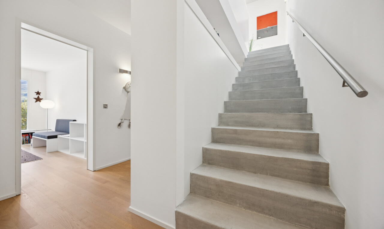 staircase featuring light wood finished floors