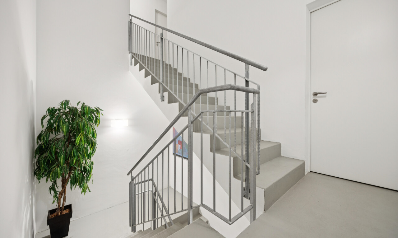 stairway with finished concrete floors