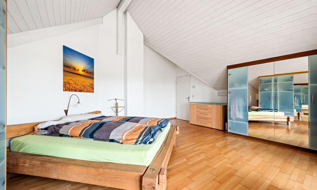 room featuring wood finished floors and beamed ceiling