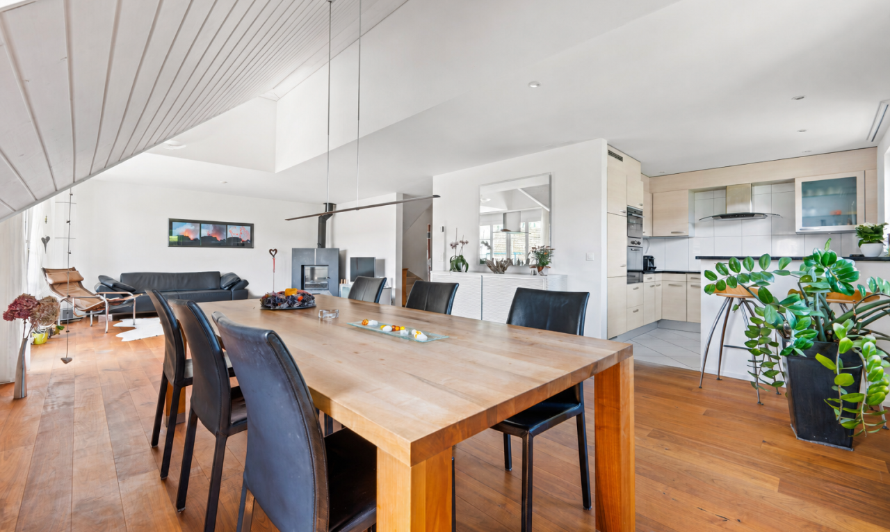 dining space with light wood finished floors, lofted ceiling, and a ceiling fan