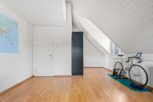 exercise room featuring light wood-style flooring and a vaulted wooden ceiling