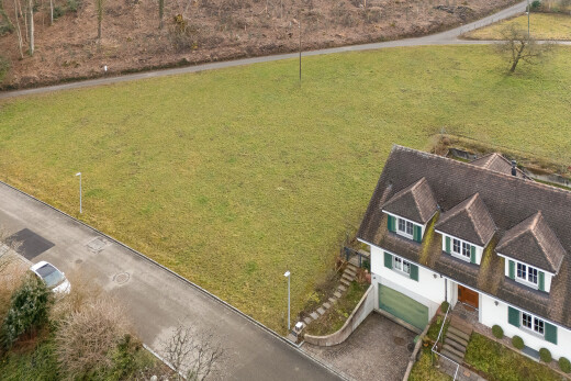 view of home featuring an attached garage and driveway