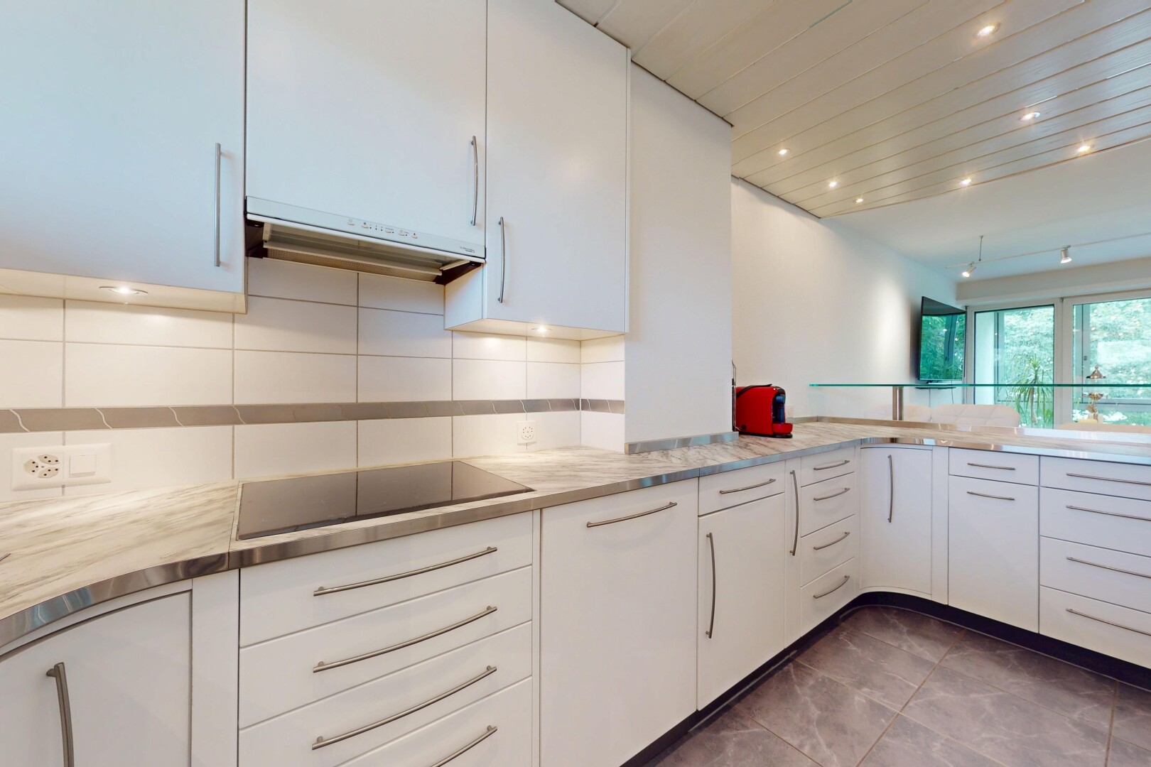 kitchen featuring white cabinetry, extractor fan, backsplash, light countertops, and recessed lighting