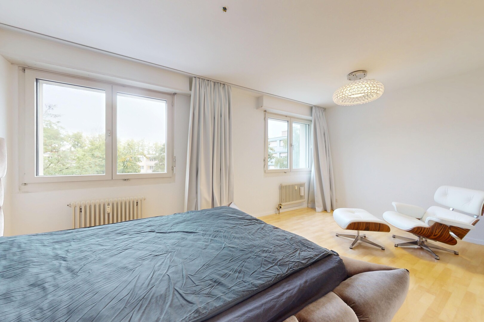 room featuring radiator heating unit and wood finished floors
