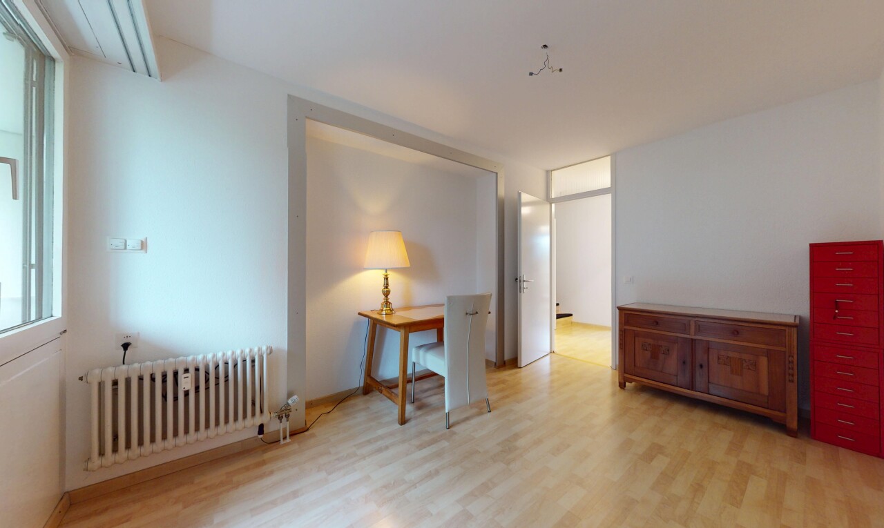 spare room featuring radiator heating unit and light wood-type flooring