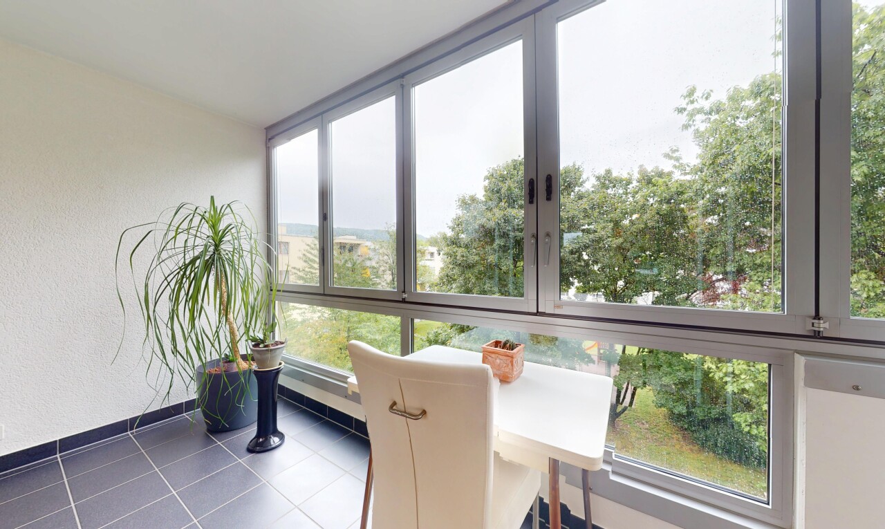 tiled dining space featuring baseboards