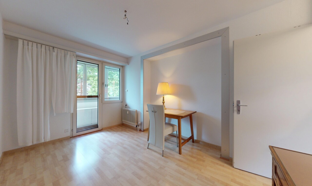 unfurnished room featuring light wood-style flooring and radiator heating unit
