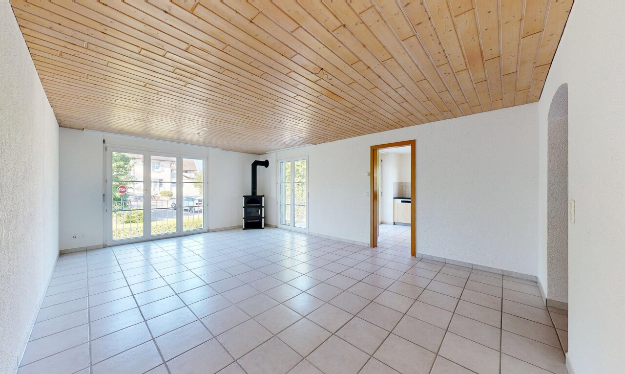 leerer raum mit inside property, holzofen, natural light, natürliches licht, und light floor