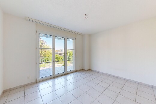 empty room featuring light tile patterned flooring and baseboards