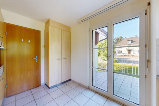 empty room with light tile patterned floors and baseboards