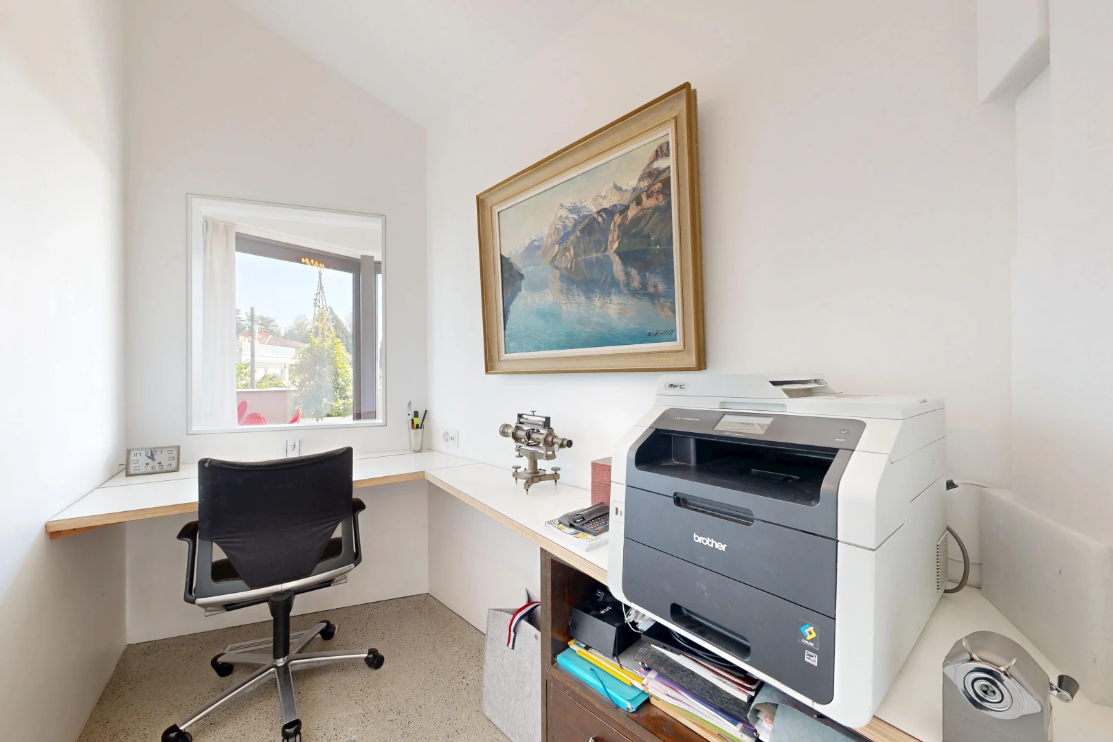 office with built in study area and vaulted ceiling