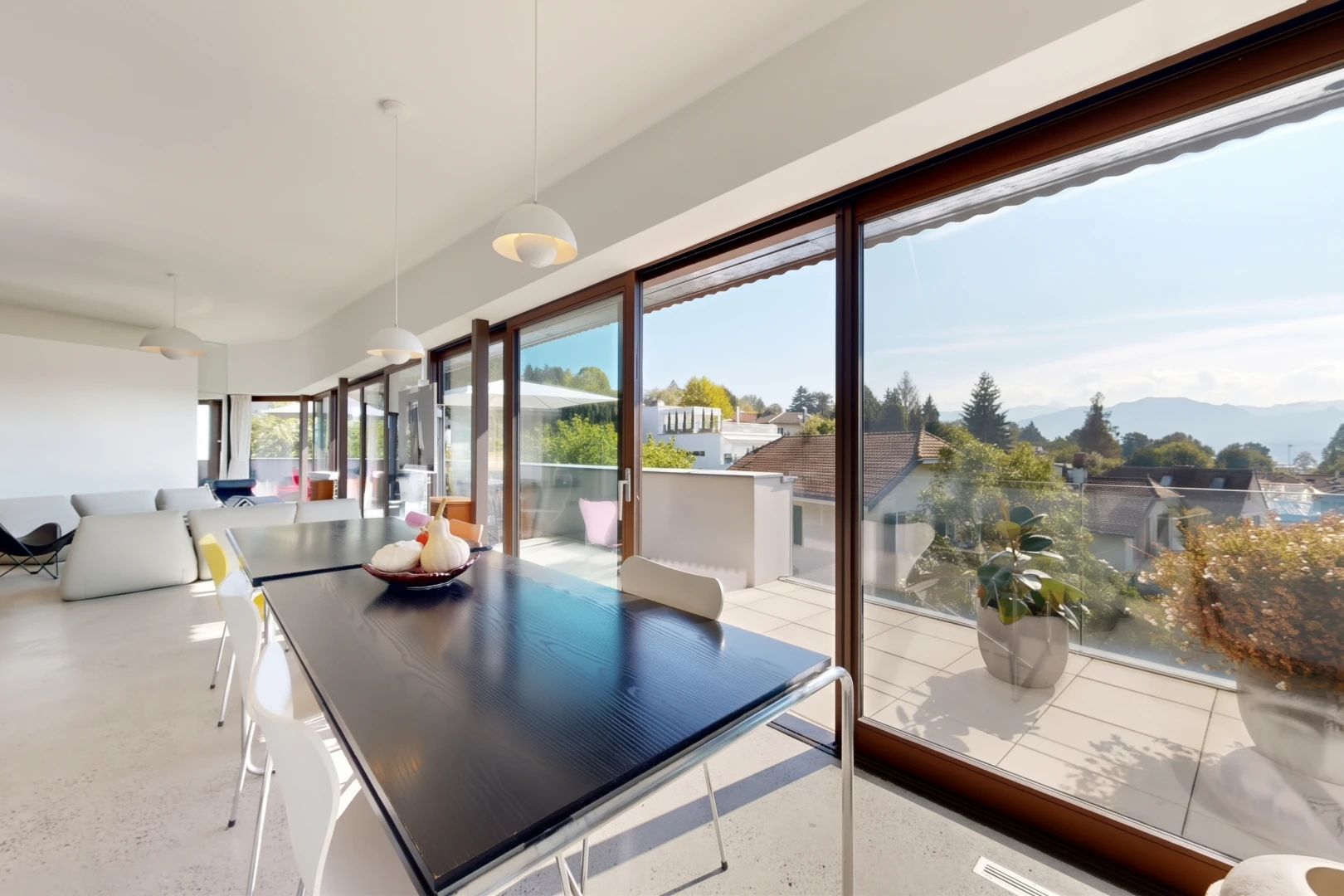 dining space featuring pendant lighting and access to exterior