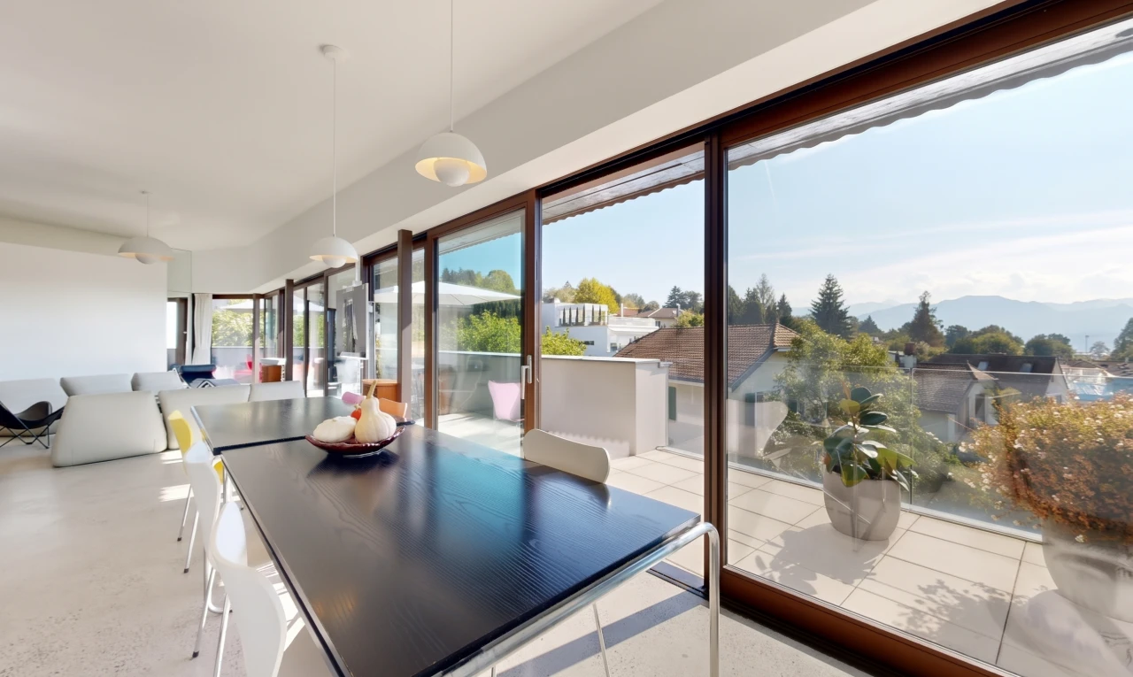 dining space featuring pendant lighting and access to exterior