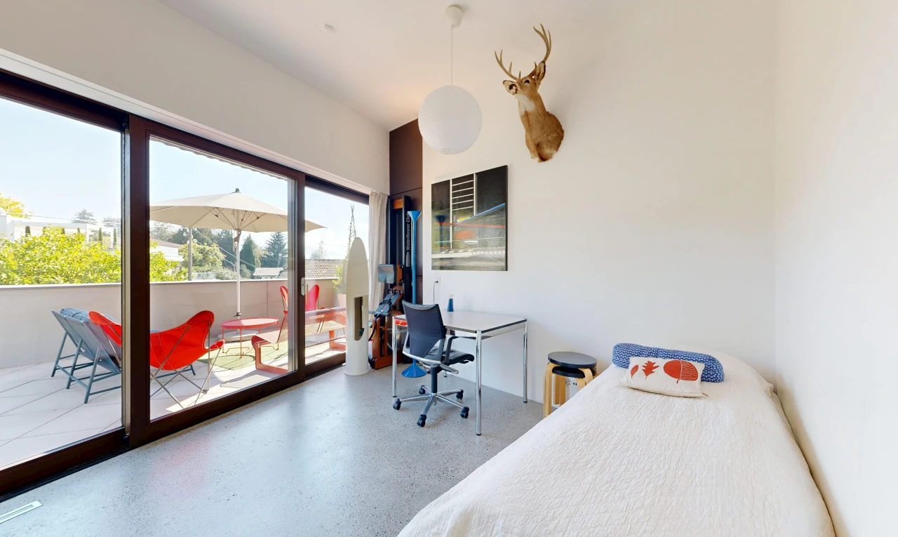 room with access to exterior, an office area, and hanging light fixtures