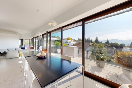 dining space featuring pendant lighting and access to exterior