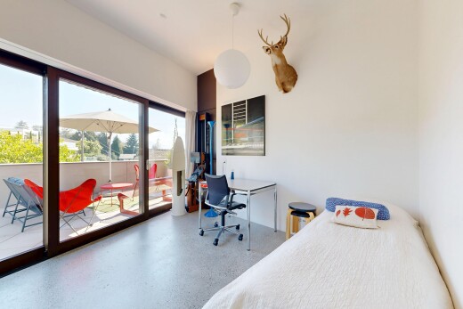 room with access to exterior, an office area, and hanging light fixtures