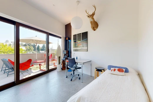 room with access to exterior, an office area, and hanging light fixtures