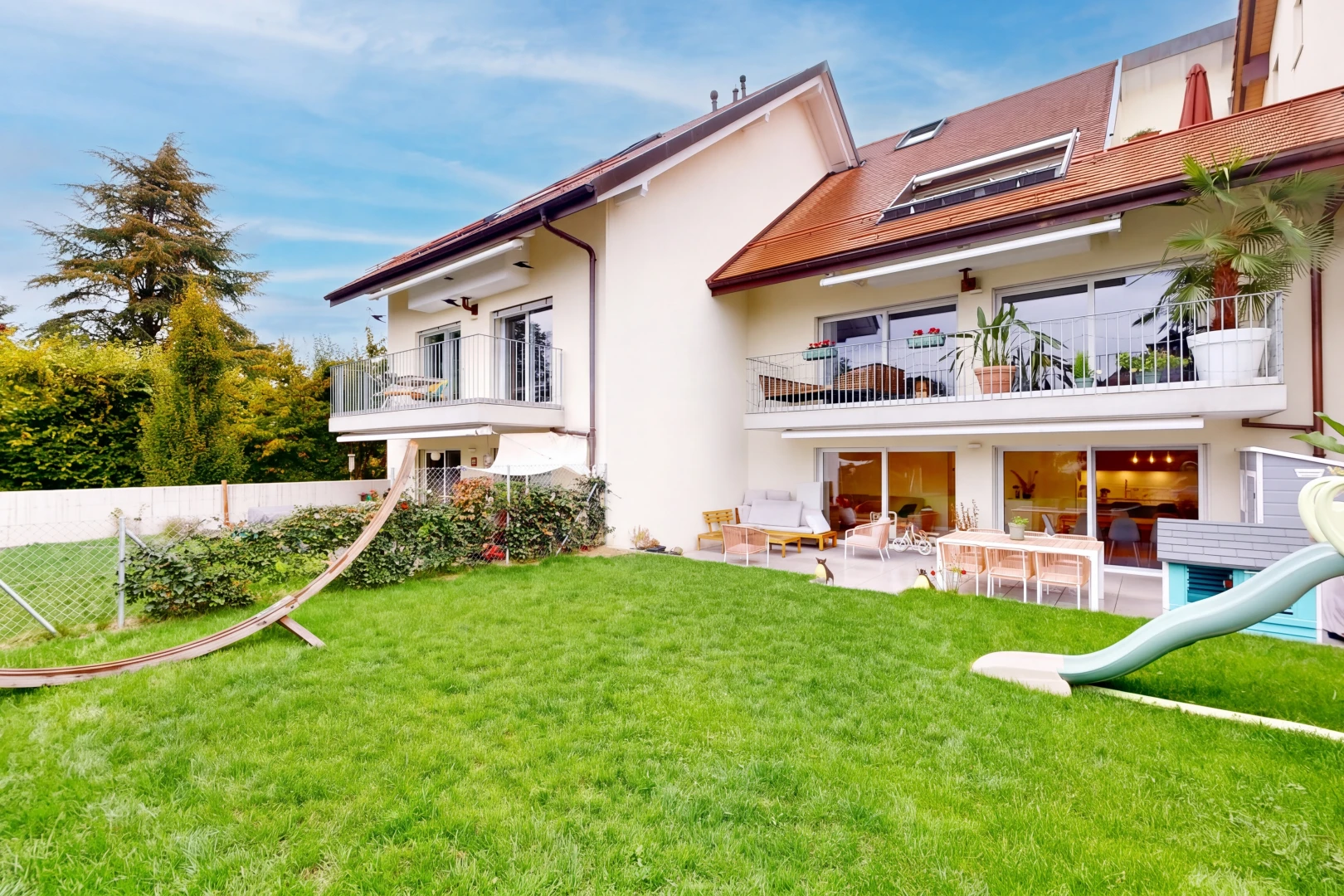 outdoor house with a balcony, a patio, and stucco siding