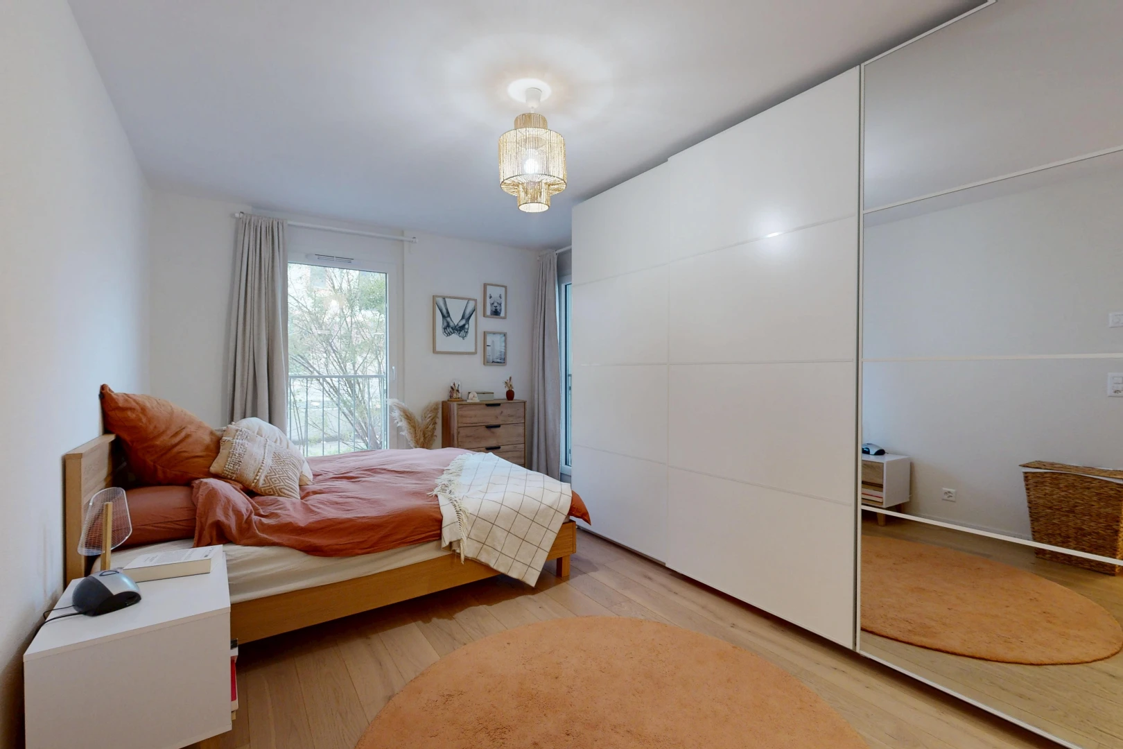 room with light wood-type flooring and a closet