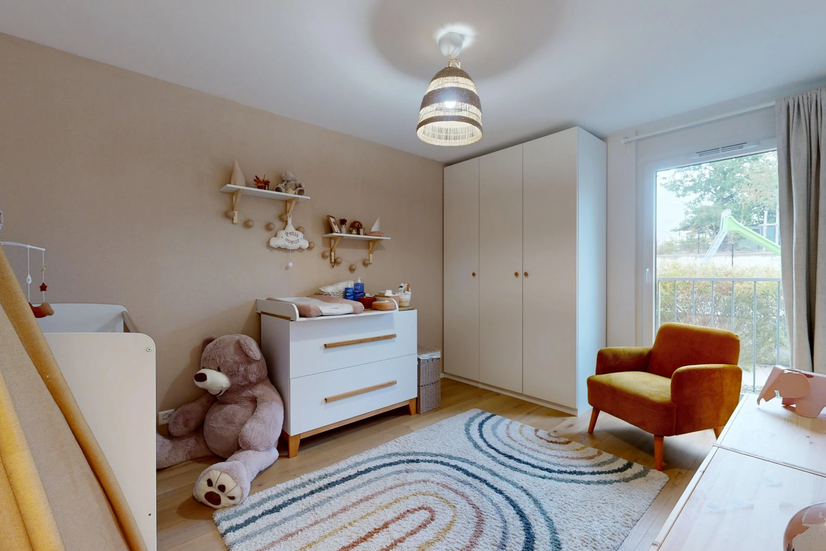 room / bedroom with light wood finished floors and a closet