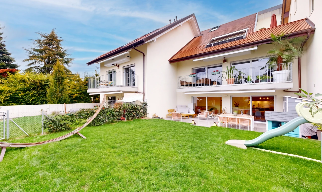outdoor house with a balcony, a patio, and stucco siding