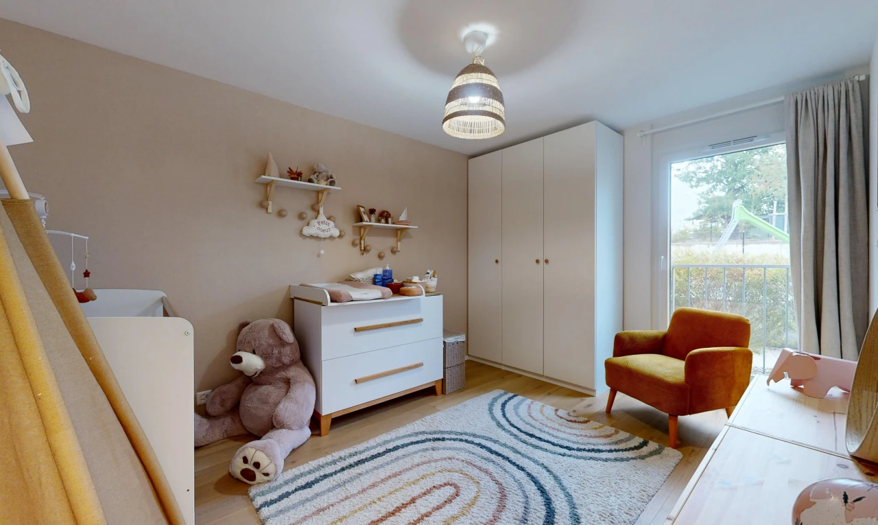 room / bedroom with light wood finished floors and a closet