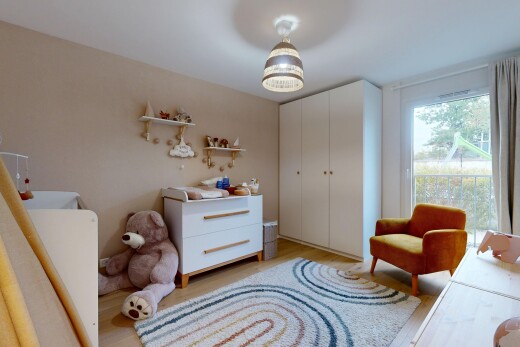 room / bedroom with light wood finished floors and a closet