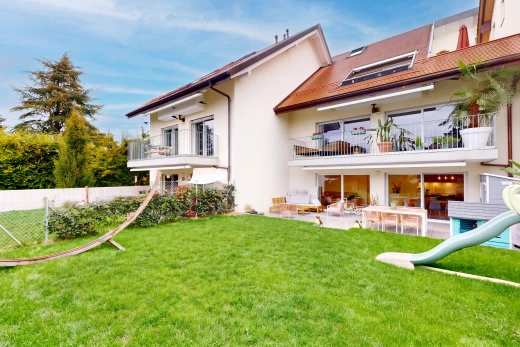 outdoor house with a balcony, a patio, and stucco siding