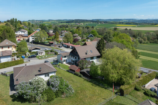 view of property featuring a residential view and a lawn