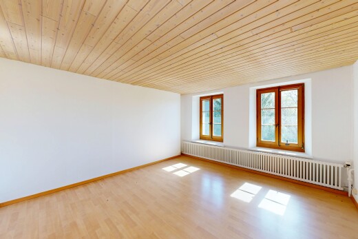 unfurnished room featuring radiator heating unit, wooden ceiling, and light wood-style floors