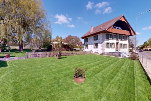 outdoor house featuring a fenced backyard, a chimney, and a playground