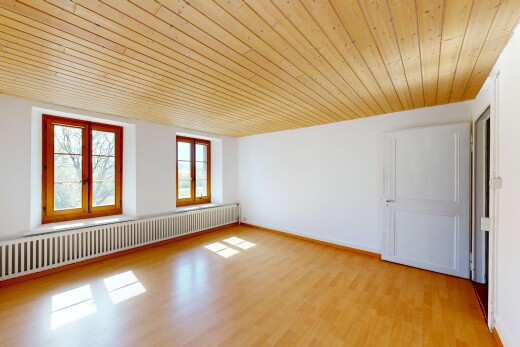 spare room featuring radiator heating unit, wooden ceiling, and light wood-style flooring