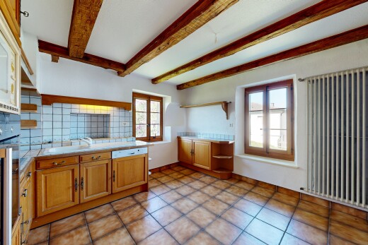kitchen featuring open shelves, decorative backsplash, radiator heating unit, oven, and wood finish cabinetry