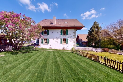 outdoor house featuring a chimney