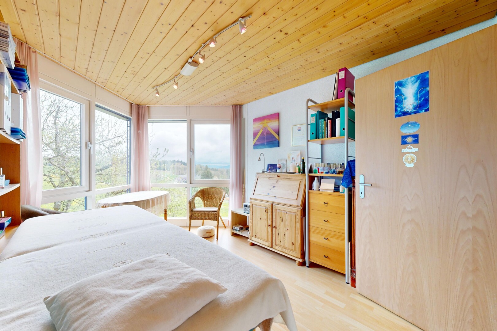 room / bedroom with track lighting, wood ceiling, and light wood finished floors